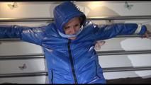 Mara tied, gagged and hooded on bed with cuffs wearing a sexy blue downwear combination (Video)