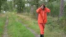 Miss Petra takes a walk in a orange AGU rain suit and rubber boots