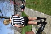 Watching Pia sweeping the terrace wearing a sexy black shiny nylon shorts, a striped top and black rubber boots (Pics)