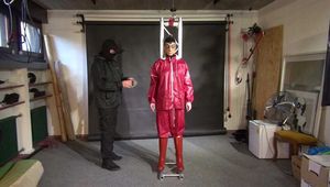 Lady M tied and gagged in shiny nylon Rainwear