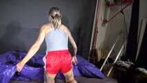 Watch Maly enjoying her shiny nylon Bedsheets in her Shiny nylon Shorts