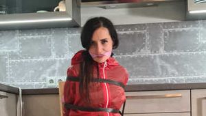 Miss Amira in sexy PVC Catsuit and raincoat bound and gagged