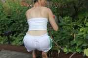 Watching sexy Sonja wearing white shiny nylon shorts and a top during watering the garden (Pisc)