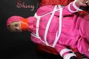 Watching sexy Pia being tied and gagged with ropes and a clothgag on a hairdressers chair wearing a very sexy pink rainwear combination with hood (Pics)