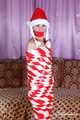 Bekki - Mummified for Christmas in red and white tape