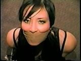 30 YR OLD ASIAN LI-JUN IS WRAP TAPE GAGGED, BALL-TIED, TOE-TIED IN PANTYHOSE (D55-11)