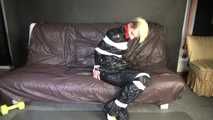 ***NEW MODELL COURTNEY*** wearing a sexy black shiny nylon rain pant and a a black rain jacket being tied and gagged with tape and a ballgag on a sofa (Video)