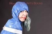 Mara tied, gagged and hooded with tape and a ball gag on a bar stool in a studio wearing a sexy oldschool lightblue downwear skibib (Pics)