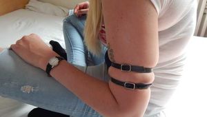 Tight little leather straps around Janes soft upper arms