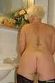 Blonde MILF Claudia gets naked in the bathroom