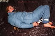Katharina tied and gagged in a blue skisuit