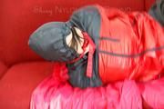 Jill tied, gagged and hooded by Sophie wearing a sexy red/blue rainwear combination (Video)