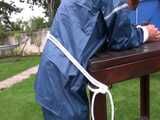Watch Sandra beeing bound, gagged with a Pantyhood in her oldschool Rainsuit 