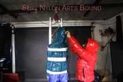 SEXY RONJA wearing shiny nylon downwear being tied and hooded with tapes from Stella on a rack (Pics)