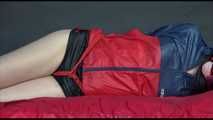 *** HOT HOT HOT*** NEW MODELL*** DESTINY wearing a sexy black/red shiny nylon shorts and an oldschool red/blue rain jacket tied and gagged on bed with ropes and a cloth gag (Video)