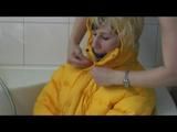 03:40 Min. video with Julia tied and gagged in a yellow downjacket and rainpants in a bathtube