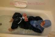 Watching Stella being tied and gagged with ropes and a cloth gag in a bathtub diving under water (Pics)