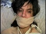 26 Yr OLD K-MART CLERK IS RING-GAGGED, BALL-TIED, IS RING GAGGED, MOUTH STUFFED, BIKINI TOP GAGGED, BALL-GAGGED, ACE BANDAGE GAGGED, BLINDFOLDED, TOE-TIED & DROOLING WHILE SITTING BALL-TIED AND NAKED ON THE FLOOR (D65-2)