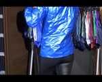 Sonja wearing a sexy black shiny skinny pant and a shiny blue down jacket trying on several shorts (Video)