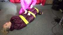 See Sophie tied and gagged by Ronja in shiny Downwear